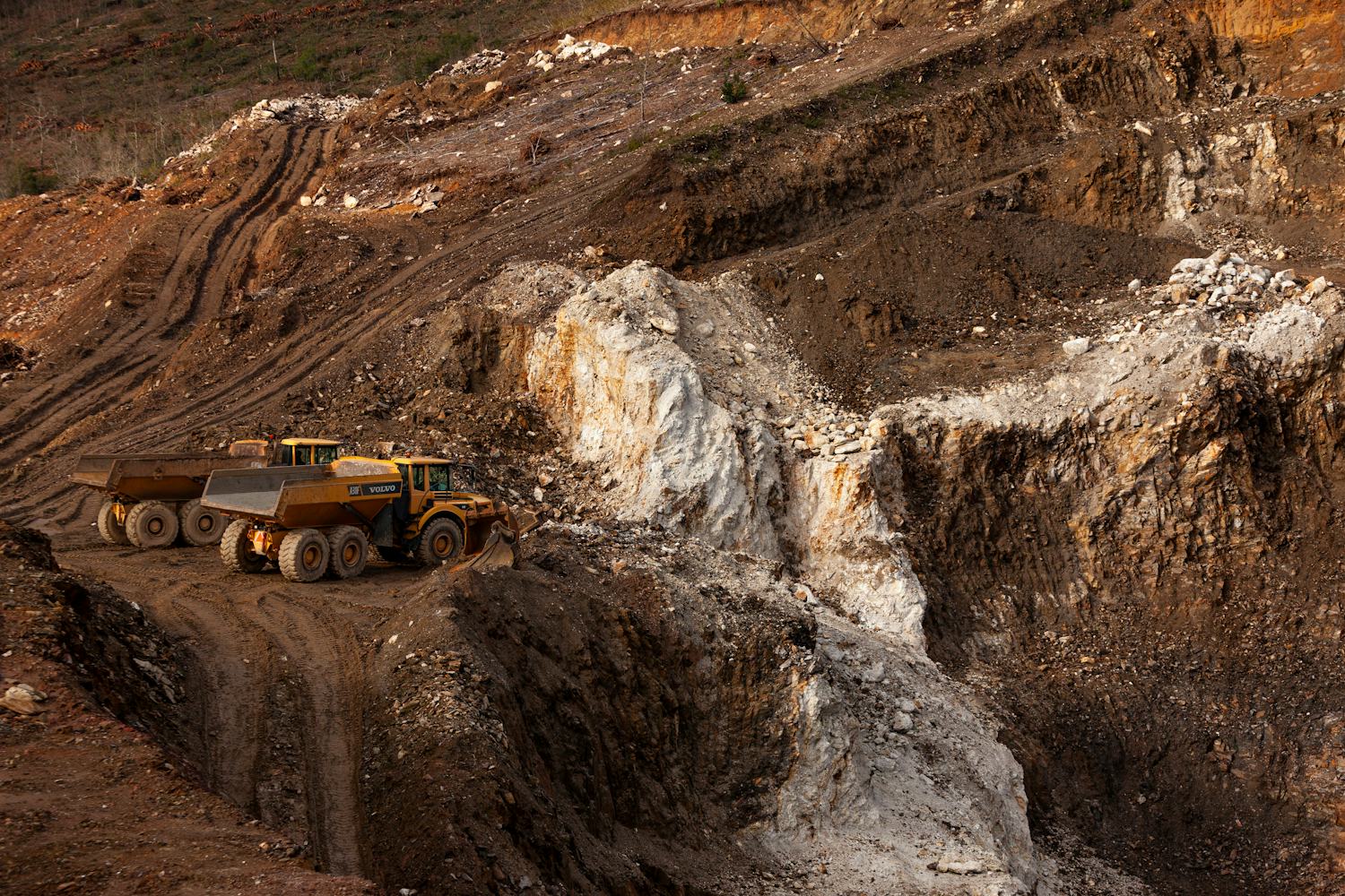 Haul trucks working an open pit mine
